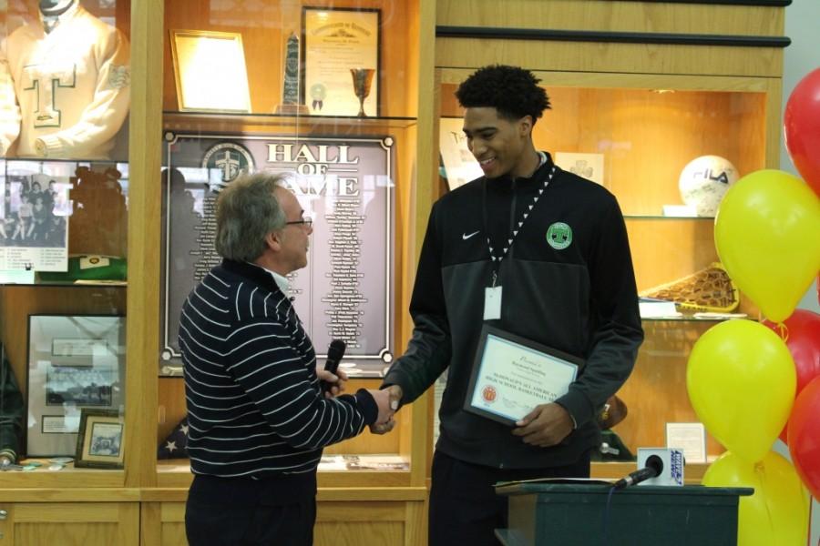 Local McDonalds owner/operator Perry Krause presented Trinity senior Raymond Spalding with a nomination to play in the annual McDonalds All-American Games.  Spalding was the only male basketball player from Kentucky to receive this honor. 