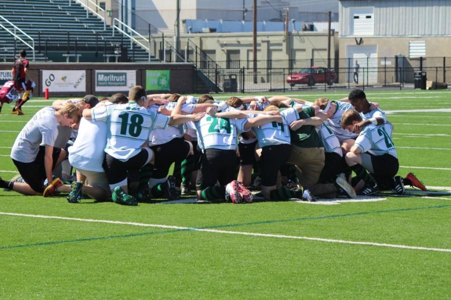 The rugby Rocks pray before a match against Culver Military Academy in March. 