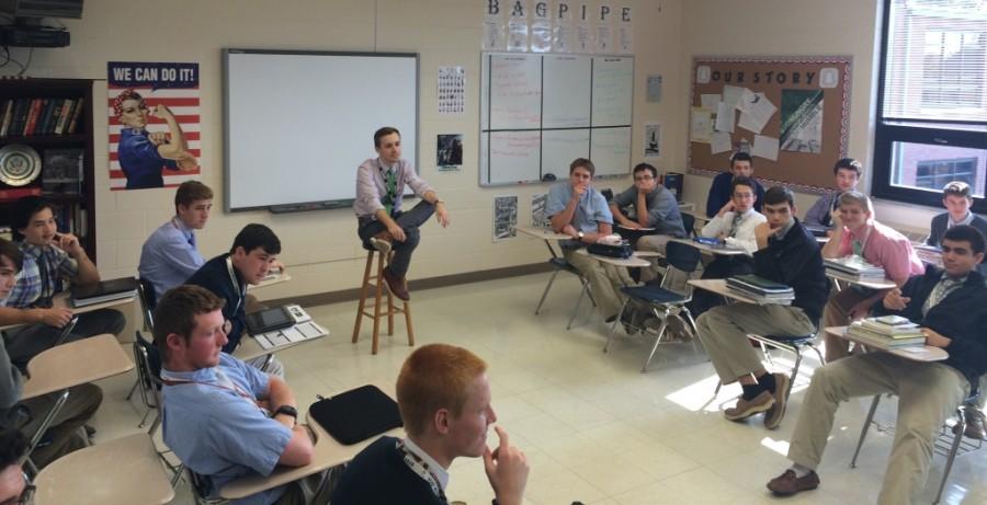 Trinity teacher Mr. Parker Whitehouse talks with his history class. 