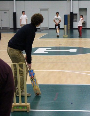 Senior Lucas Harten waits for a pitch from Jeremy Borden during cricket action. 