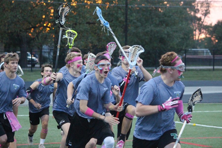 The lacrosse Rocks compete against Sacred Heart to raise money to fight breast cancer. 