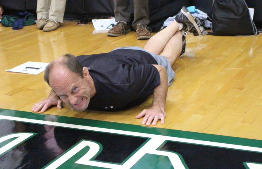 Mr. Michael Budniak puts his all into the pushups Principals Challenge.