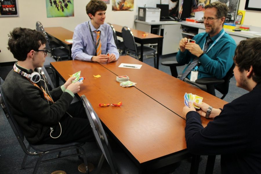 Michael Davis, Ian Barry, Principal Mr. Dan Zoeller and Hunter Mulloy during a recent game of Ultimate Uno. 