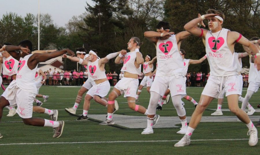 The Rocks performed at halftime of the Pink and White flag football game. 