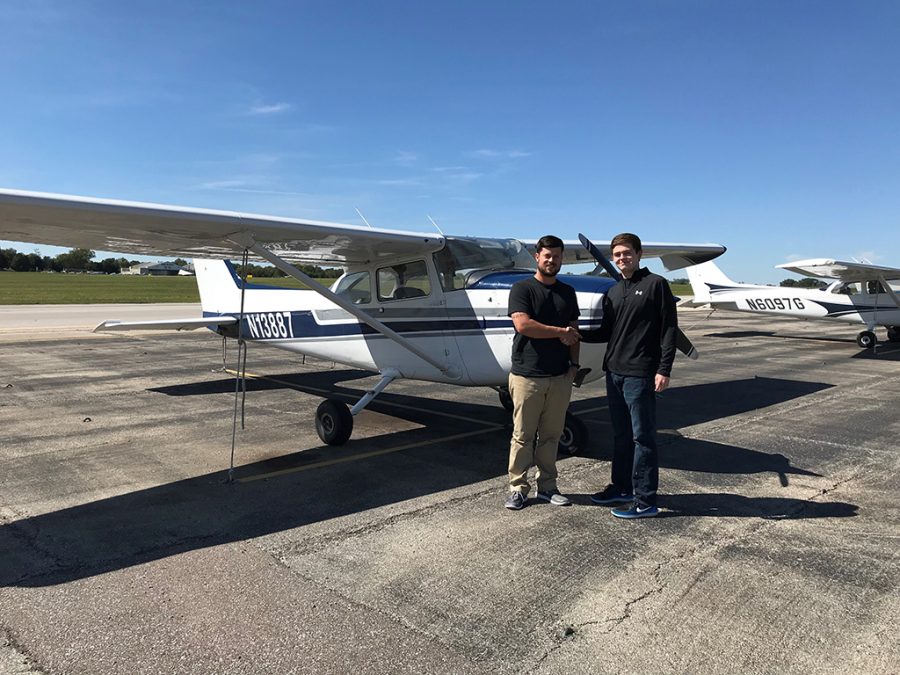 Flight instructor Eric Jameson and Trinity senior Jared Roberts