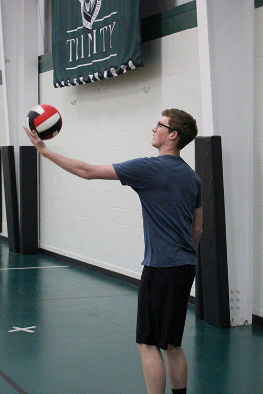 A.J. Hawes, Class of 2018, prepares to put the ball in play during intramural volleyball action. 