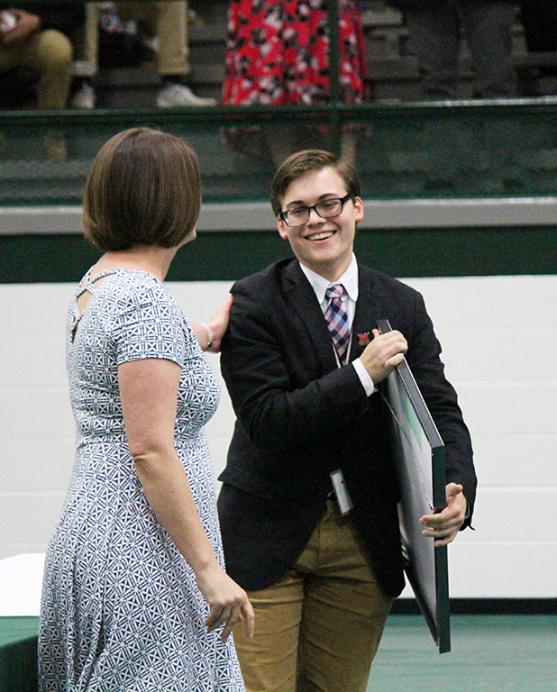 Senior Alex Cox received the Trinity Faculty Award, presented by Mrs. Betsy deGolian of the Faculty Senate.