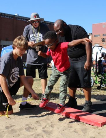 Rocks Lend Hand at Bill Roby Track and Field Games