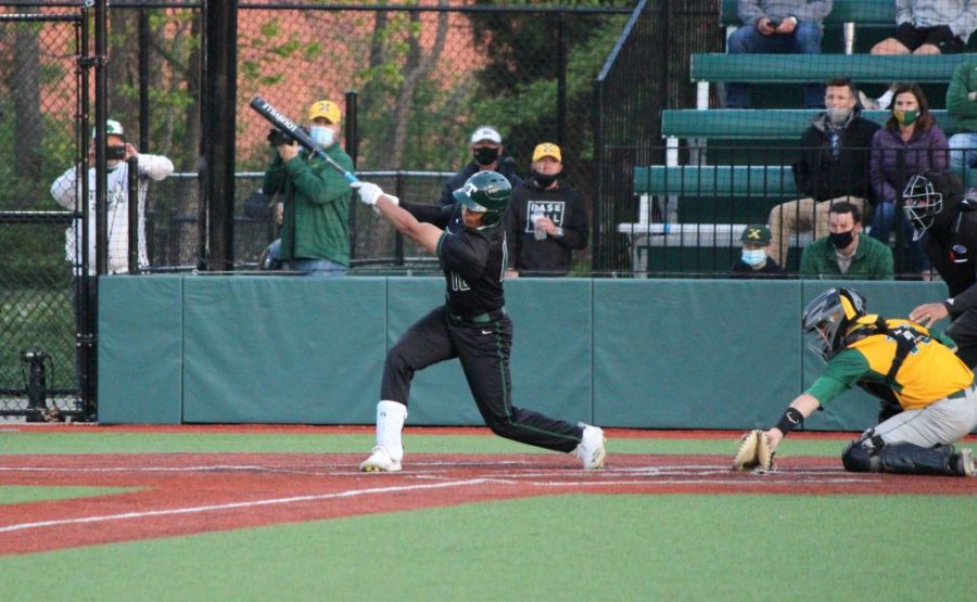 Trinitys Daylen Lile gets a hit against St. Xavier. The 33-2, No. 1-ranked Rocks prepare for postseason play.