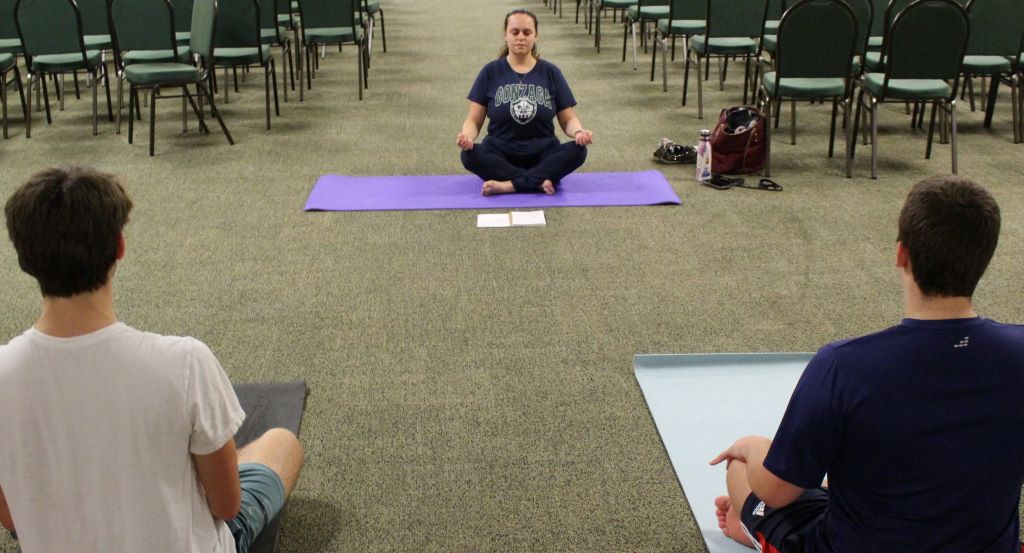 Ms. Julia Nazarenko conducts a yoga session during the first semester. 