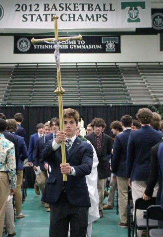 Class of 2023 President George Ferree leads the procession after the Junior Class Mass. 