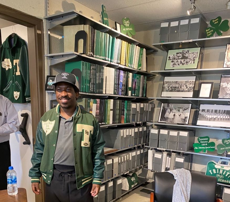 Mr. Rodrick Thompson models a letter jacket in the Trinity Archives. 