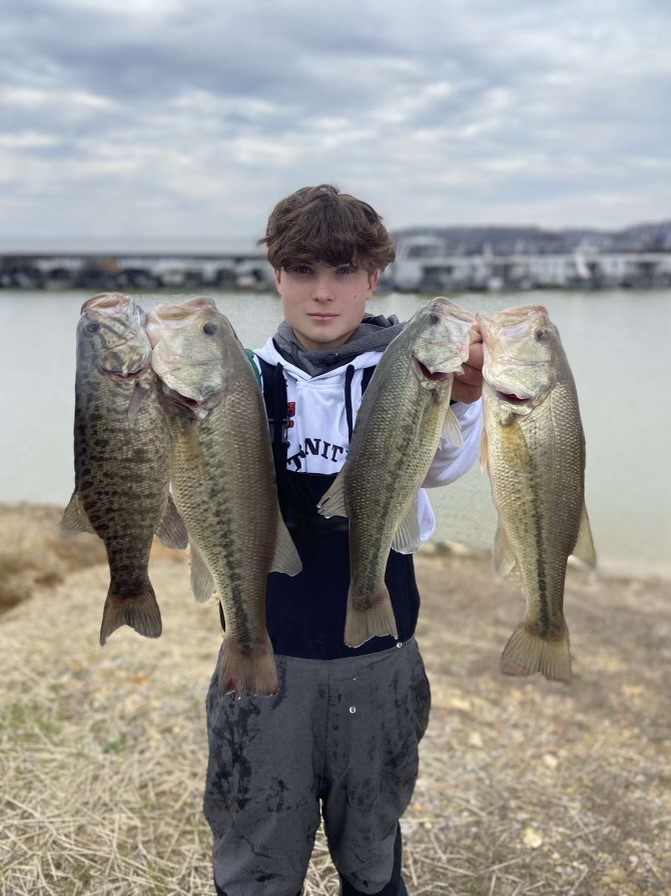 Junior Porter Conover holds his catch. Upcoming for the fishing team Rocks: the KHSAA Region 2 (Apr. 27 at Lake Cumberland), the KHSAA State Championship (May 11 at Kentucky Lake) and the Kentucky Major League Fishing State Championship (May 20 at Barren River Lake).