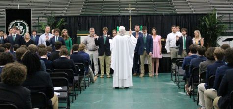 Senior Class officers for 2024 receive a blessing from Chaplain Fr. Dave Zettel 58. 